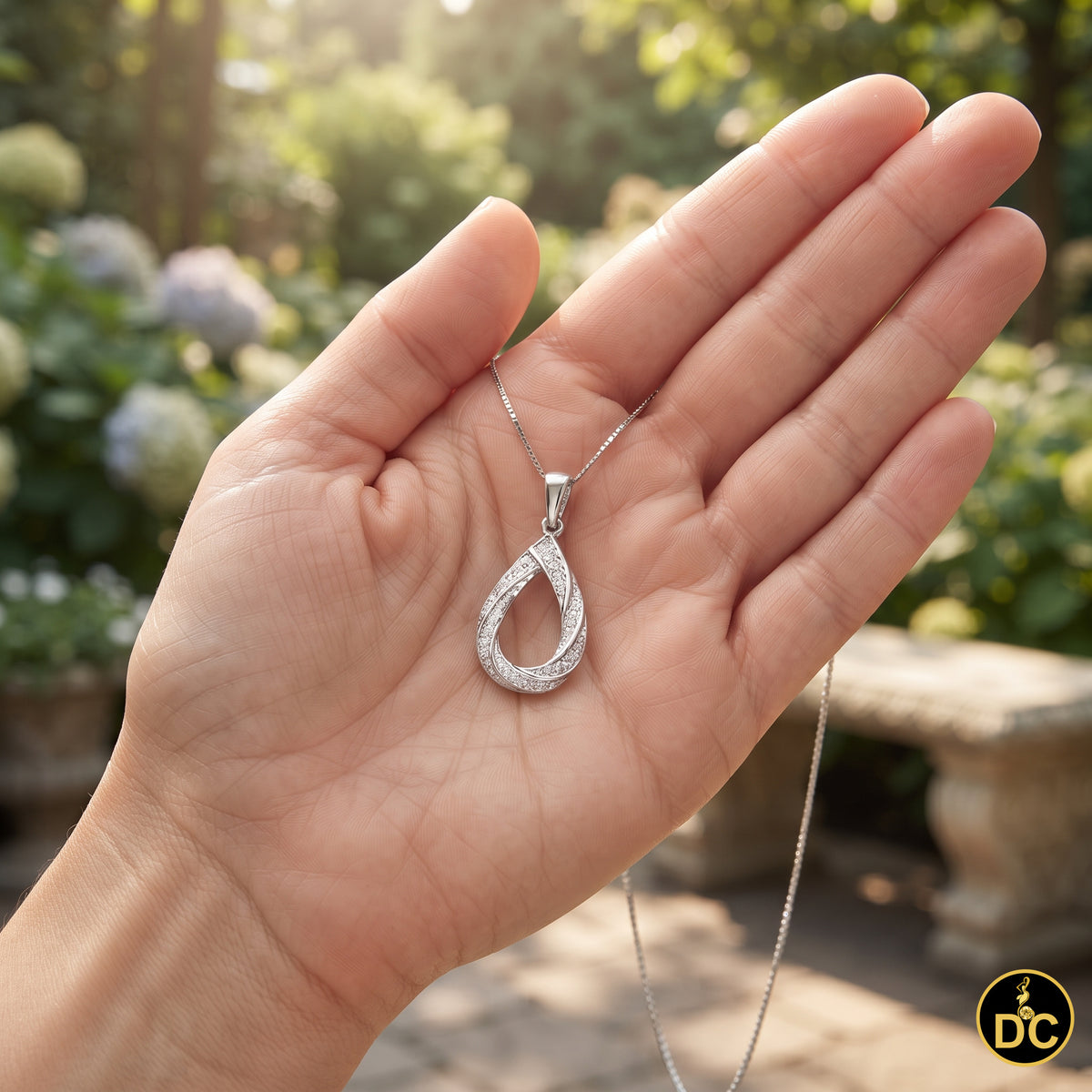 DiamondCelebritees 925 Sterling Silver Teardrop/Pear Shaped intertwined 0.37ct Cubic Zircon Pendant
